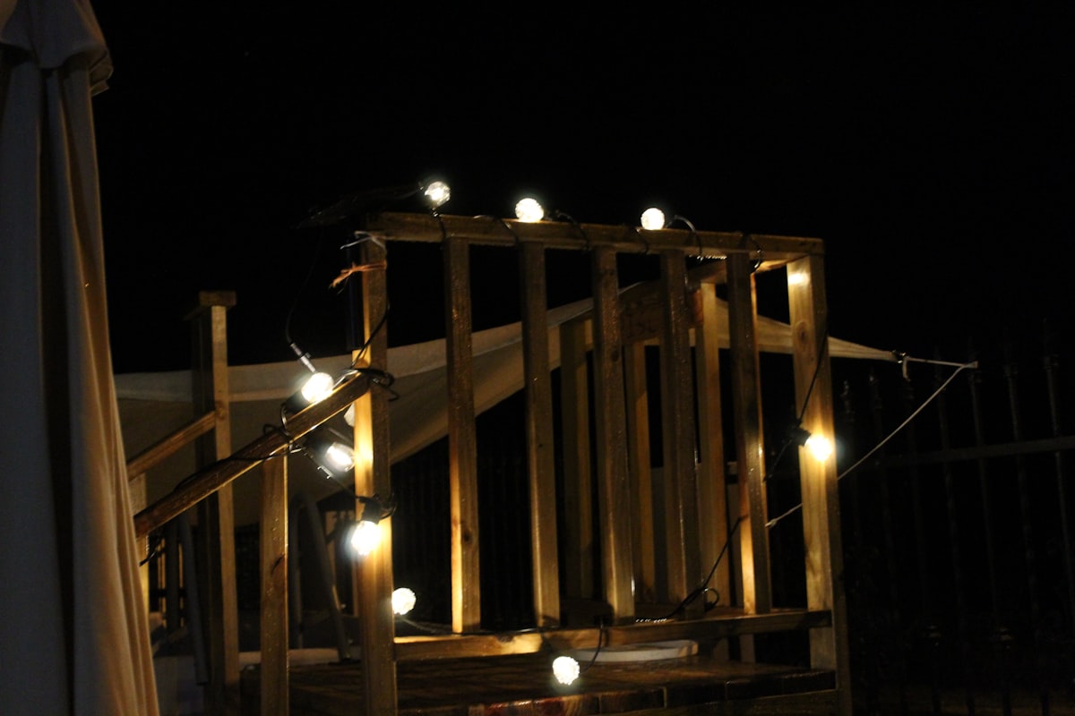 a wooden structure with some lights on it related to How to Create a Magical DIY Canopy Bed with Lights