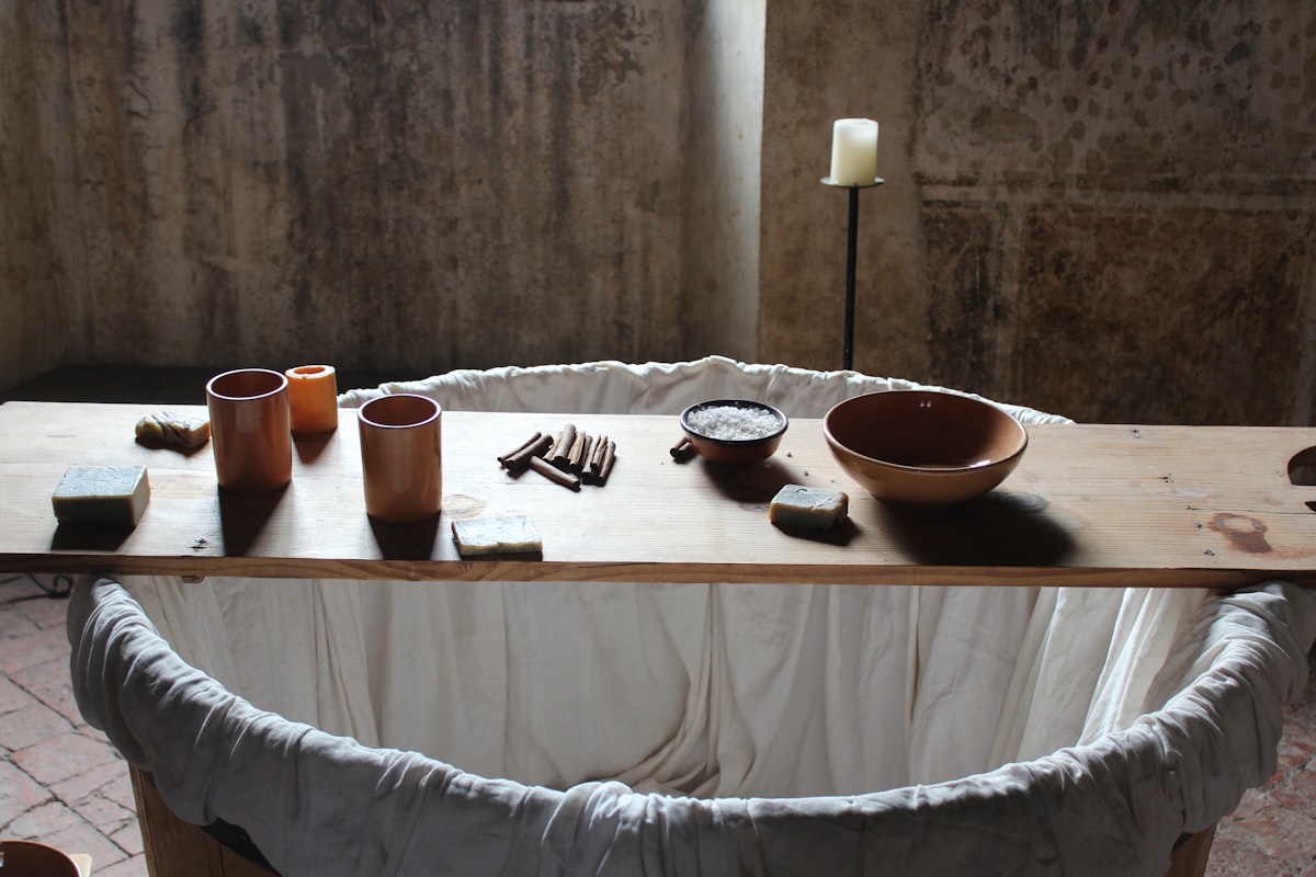 a wooden table topped with bowls and candles related to Elevate Your Dining Experience with Bed Bath and Beyond Table Runners