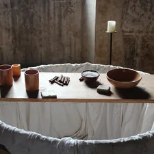a wooden table topped with bowls and candles related to Elevate Your Dining Experience with Bed Bath and Beyond Table Runners