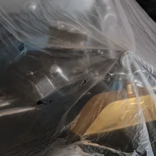 a yellow and black object wrapped in plastic related to Spray Bed Liner Cost: A Comprehensive Guide to Saving Money