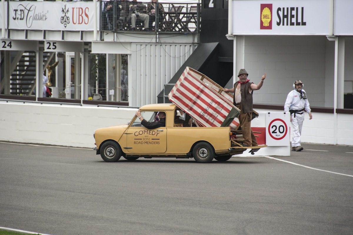 a yellow truck carrying a giant american flag related to Top Flags for Truck Beds: Show Off Your Style and Utility