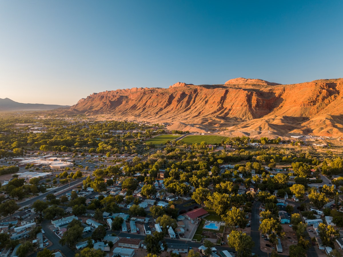 aerial photography of houses surrounded by trees related to Sleep Under Utah's Stature: Luxurious Bed & Breakfasts Await