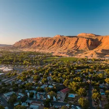 aerial photography of houses surrounded by trees related to Sleep Under Utah's Stature: Luxurious Bed & Breakfasts Await