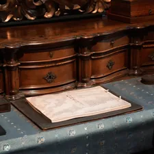 An antique desk with papers and writing tools related to Victorian Sideboard Buffet: A Timeless Statement Piece