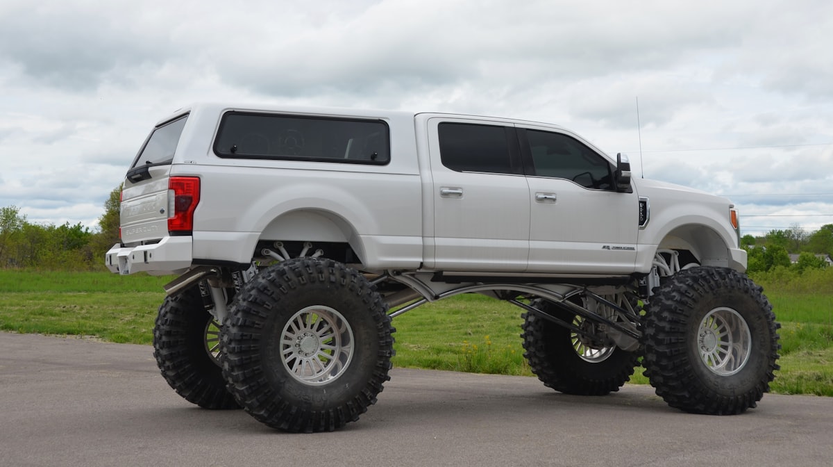 An Ekstensive built Ford Truck in white, a long way from Texas related to Protect Your Truck with Pickup Bed Caps: A Must-Have Accessory