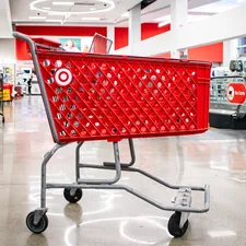 An empty red Target shopping cart within a Target store. related to Snuggle Up in Style: Explore the Ultimate Target Bedding Sets