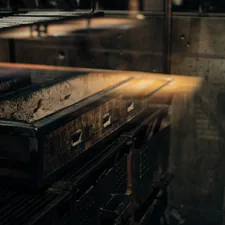 an industrial kitchen with a large metal oven related to Industrial Elegance: Reviving Vintage Metal in Modern Sideboards