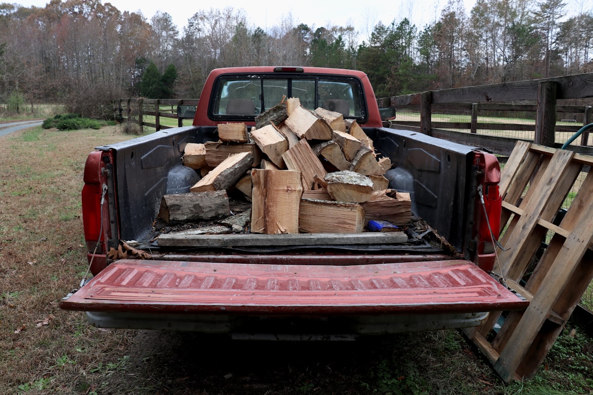 An old pickup truck loaded down with firewood. related to Enhance Your Pickup Truck's Utility with High-Quality Sideboards