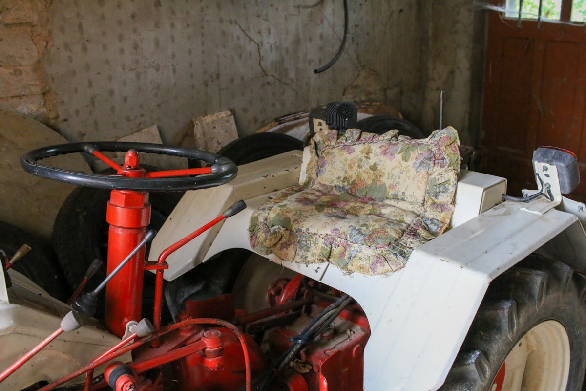 an old tractor with a floral seat cover related to Toddler Tractor Bed: The Perfect Sleep Solution for Little Farmers