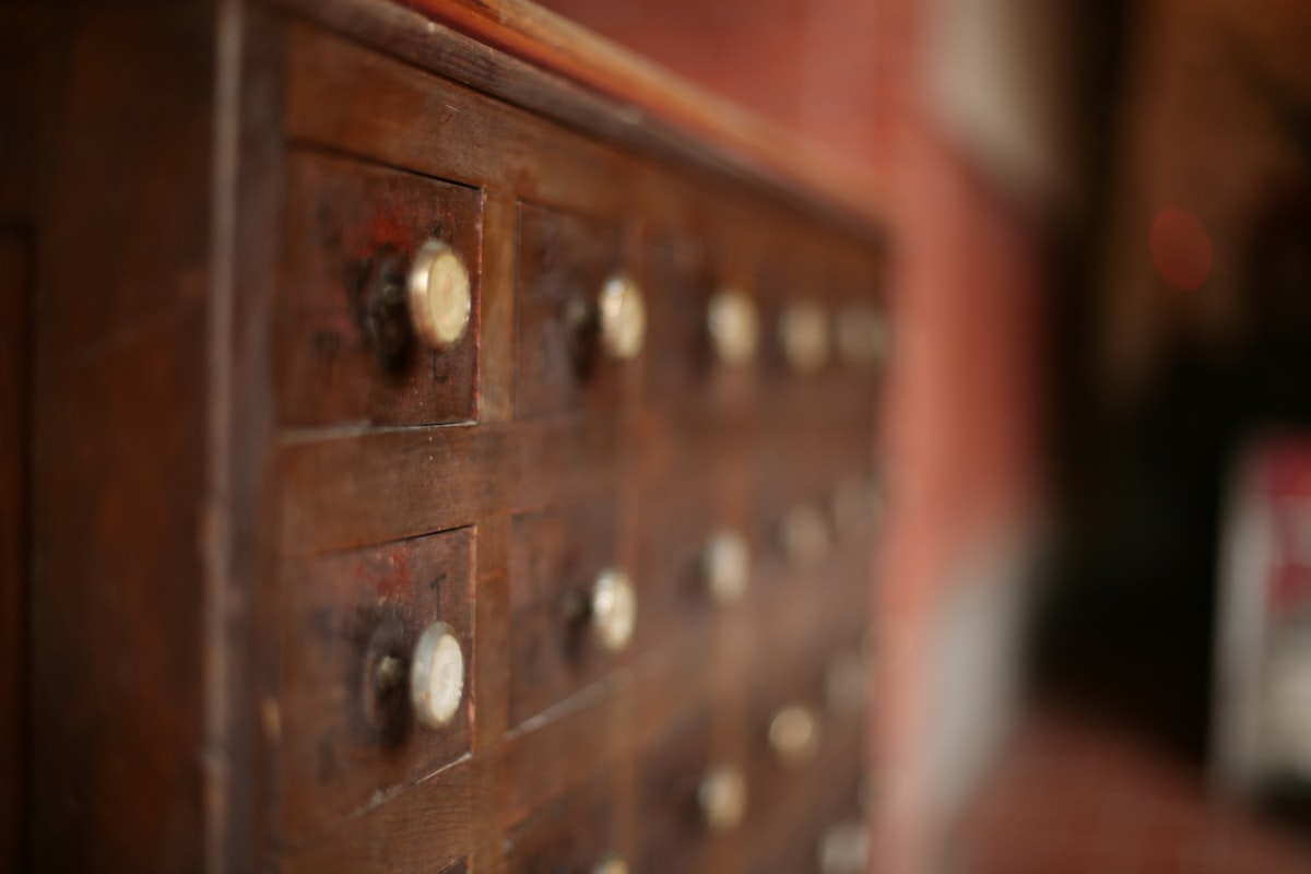 An old, wooden cabinet with several drawers. related to Elegant Antique Sideboards for Your Dream Home