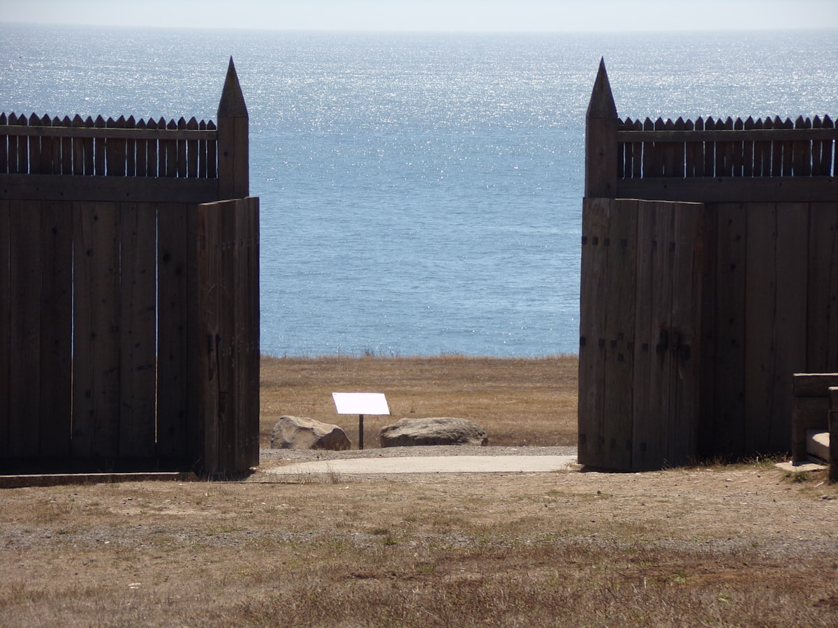 an open gate with a bench in front of a body of water related to Discover the Best Bed Bath & Beyond in Fort Myers