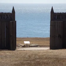 an open gate with a bench in front of a body of water related to Discover the Best Bed Bath & Beyond in Fort Myers