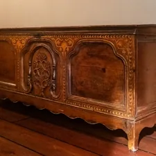 Antique wooden chest with intricate carvings and ornate details. related to Elevate Your Home Decor: The Ultimate Guide to Real Wood Sideboards