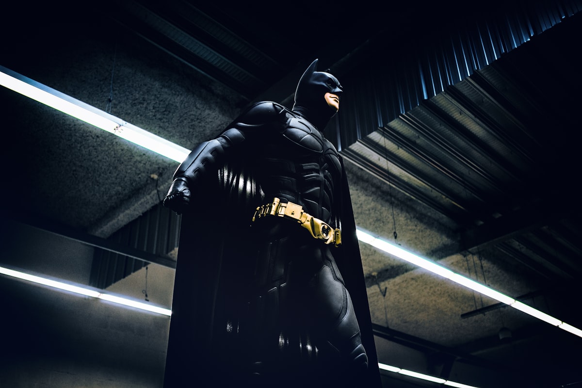 Batman standing under steel roof related to Ultimate Guide to Batman Twin Bedding