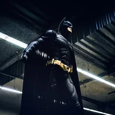 Batman standing under steel roof related to Ultimate Guide to Batman Twin Bedding
