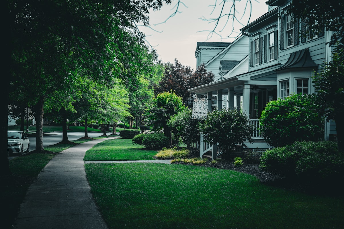 Beautiful house with a green lawn and sidewalk. related to Discover the Charm of Raleigh: Bed and Breakfast Getaways in NC