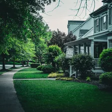 Beautiful house with a green lawn and sidewalk. related to Discover the Charm of Raleigh: Bed and Breakfast Getaways in NC