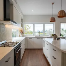 Beautiful kitchen design filled with plenty of natural light and warmth related to Adding the Perfect Touch: A Guide to Kitchen Window Valances