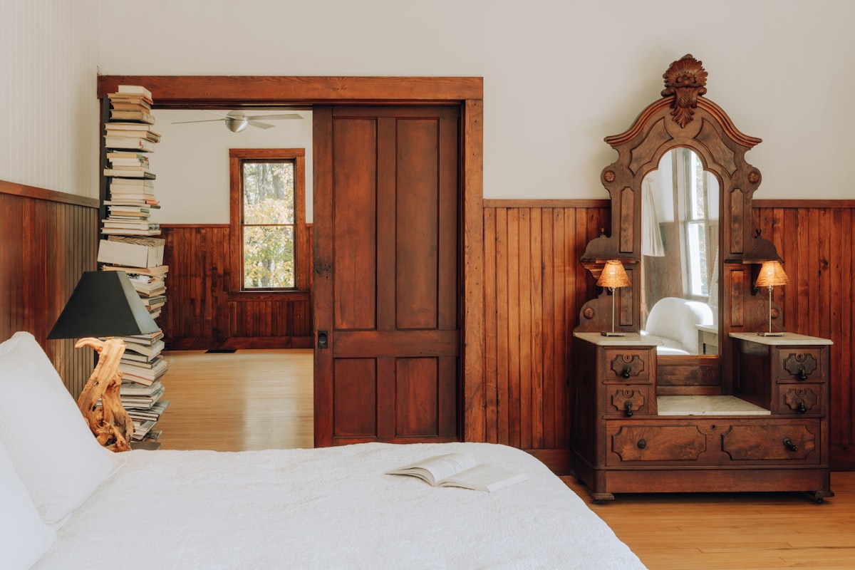Bedroom with warm wood 1/3 (IG: @clay.banks) related to La Reserve Bed & Breakfast: A Haven of Comfort and Elegance