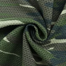 black and gray textile on white table related to Choosing the Perfect Camouflage Baby Bedding for Your Nursery
