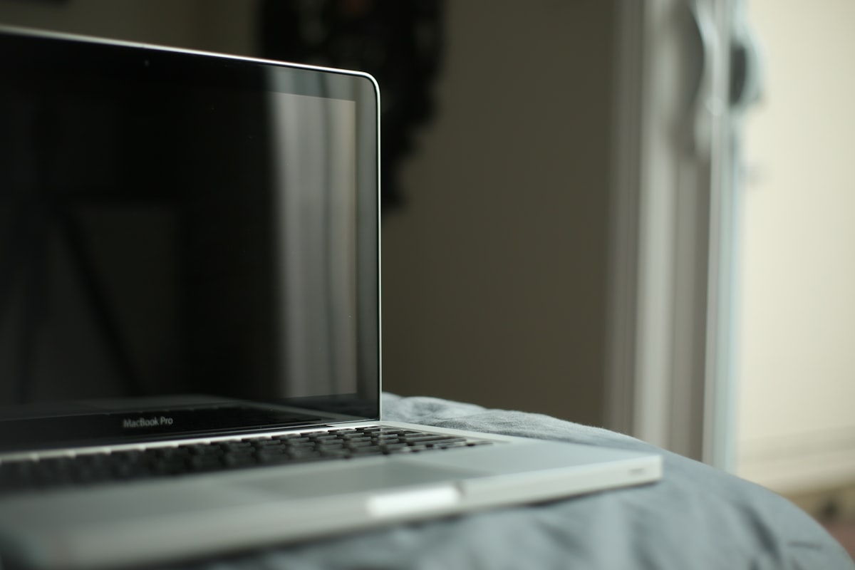black and silver laptop computer related to Elevate Your Workspace: The Ultimate Bed Laptop Table Guide