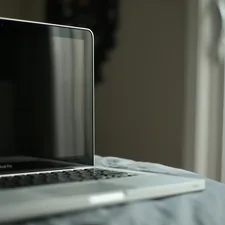 black and silver laptop computer related to Elevate Your Workspace: The Ultimate Bed Laptop Table Guide