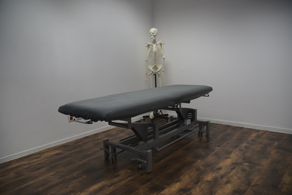 black bed frame on brown wooden parquet floor related to Hydromassage Bed for Sale: Your Gateway to Relaxation and Wellness