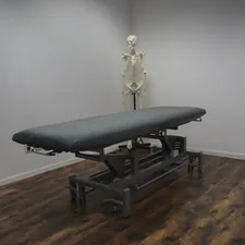 black bed frame on brown wooden parquet floor related to Hydromassage Bed for Sale: Your Gateway to Relaxation and Wellness