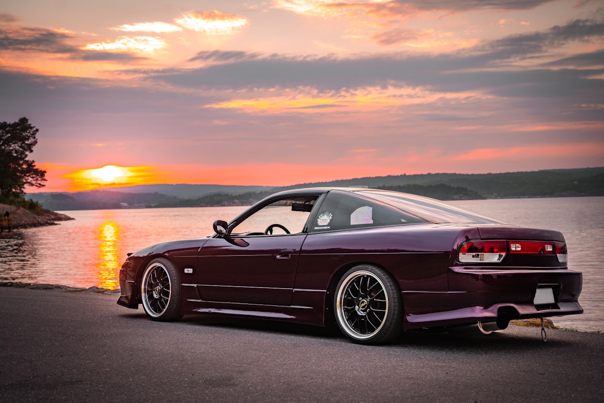 black bmw coupe on road during sunset related to Upgrading Your Rear Valance: A Guide for Nissan 180SX Owners