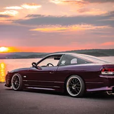 black bmw coupe on road during sunset related to Upgrading Your Rear Valance: A Guide for Nissan 180SX Owners