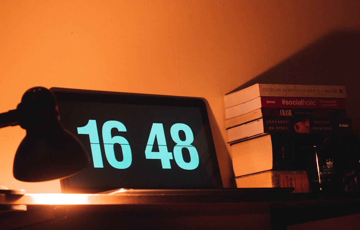 black digital clock reading at 16 48 related to Understanding the Financial Aspects of Sleep Number Beds