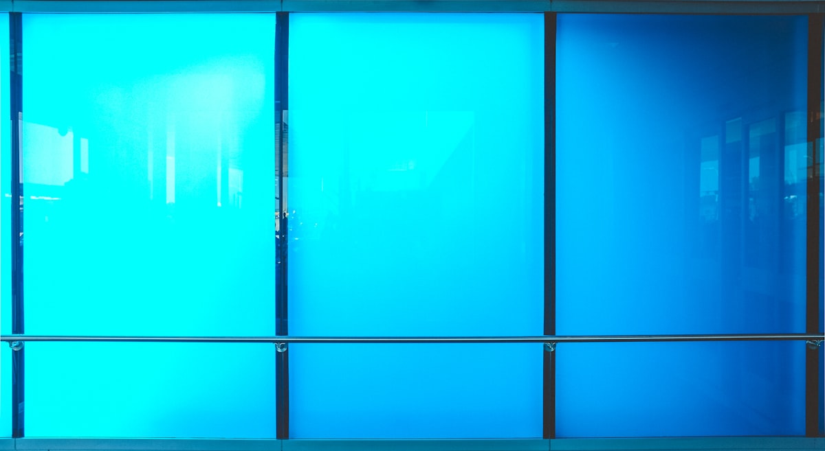 black-framed blue glass window related to Sliding Glass Door Valances: Elevate Your Window Treatment