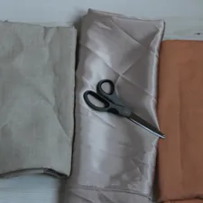 black scissors on gray textile related to How to Make a Scarf Valance