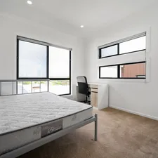 black wooden bed frame with white bed linen related to Exploring the Charm of 2 Bed Apartments: Your Perfect Urban Sanctuary