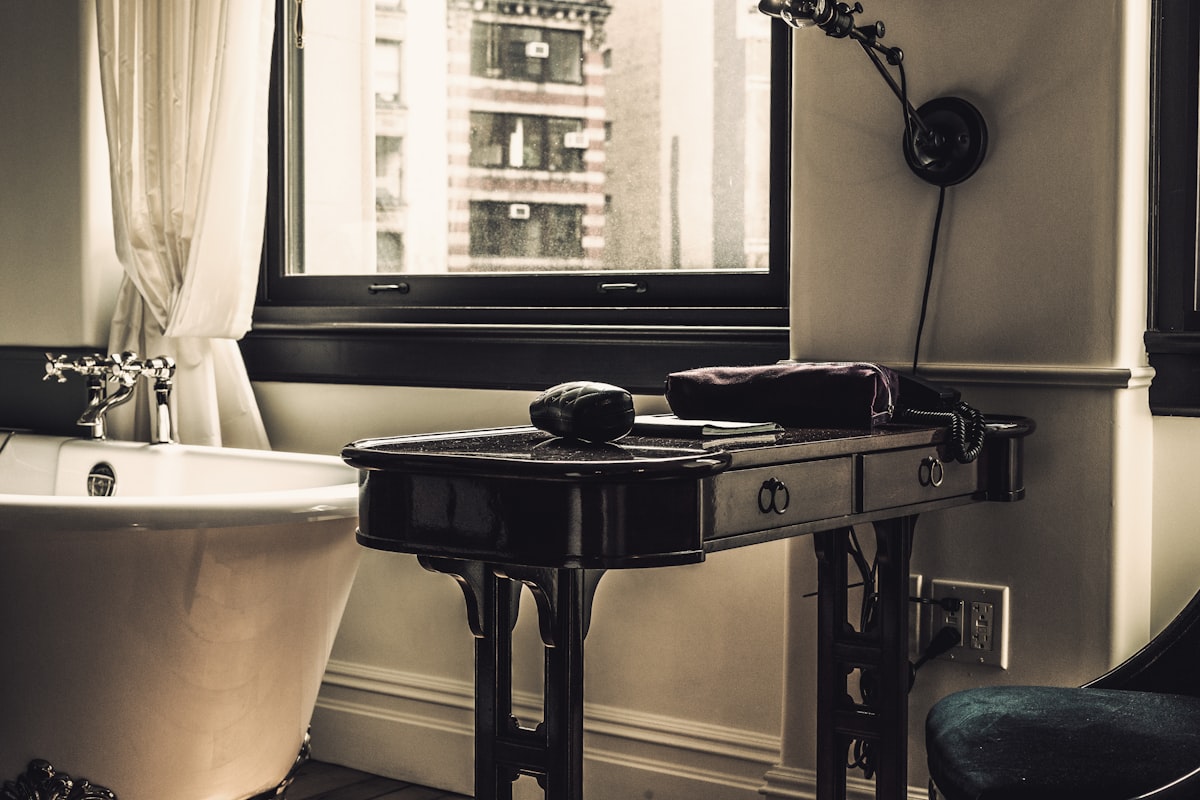 black wooden table near bathtub and wibdow related to Elevate Your Dining Experience with Bed Bath and Beyond Table Runners