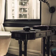 black wooden table near bathtub and wibdow related to Elevate Your Dining Experience with Bed Bath and Beyond Table Runners