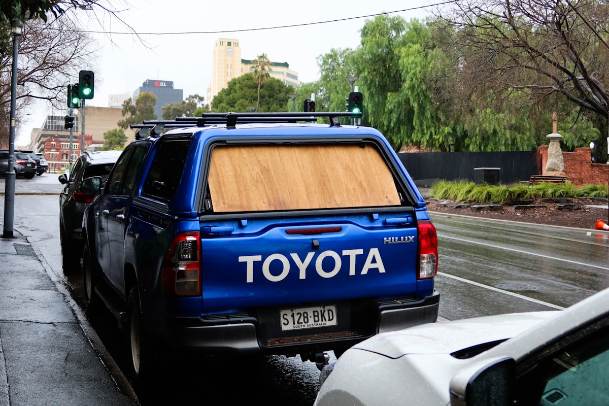 blue and black honda suv on road during daytime related to Roll with Security: The Ultimate Guide to Undercover Truck Bed Covers