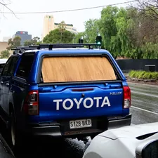 blue and black honda suv on road during daytime related to Roll with Security: The Ultimate Guide to Undercover Truck Bed Covers