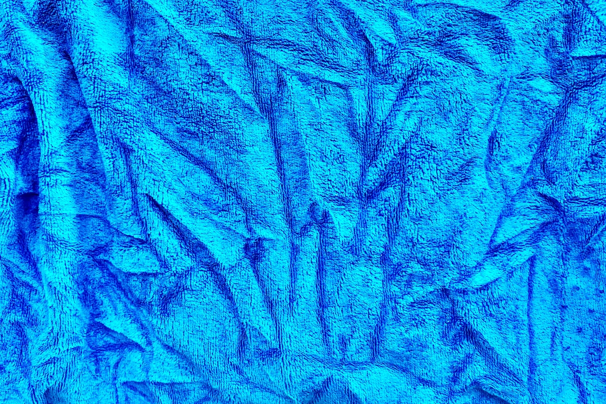 blue and white abstract painting related to Tie-Dye Dreams: How to Bring a Pop of Blue to Your Bedroom