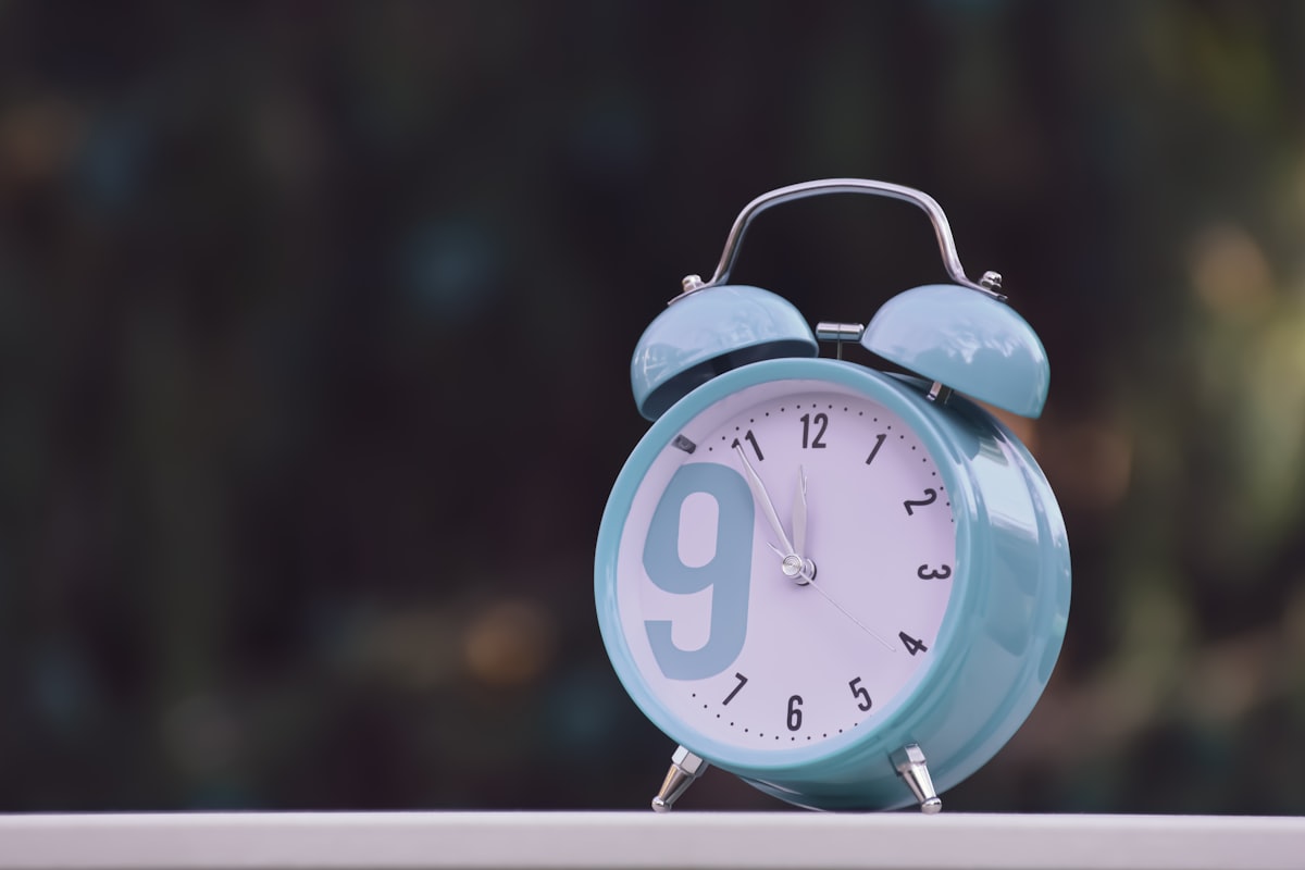 blue and white alarm clock at 10 00 related to Understanding the Financial Aspects of Sleep Number Beds