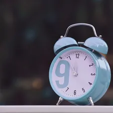 blue and white alarm clock at 10 00 related to Understanding the Financial Aspects of Sleep Number Beds