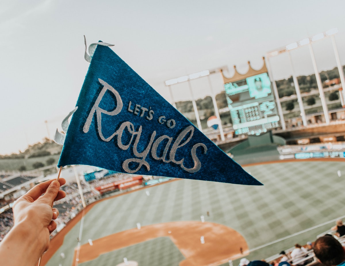 blue and white Lets Go Royal pennant related to Transform Your Bedroom with Kansas City Royals Bedding: A Home Run for Fans