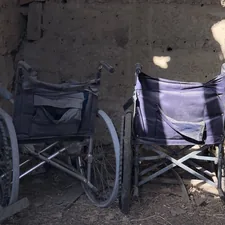 blue and white stroller on brown sand related to Chairs That Convert to Beds: The Ultimate Space-Saving Solution