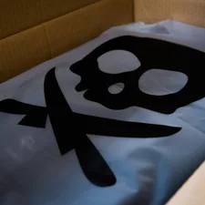blue and white textile on brown cardboard box related to Skull Bedding Sets: Adding an Edge to Your Bedroom Decor
