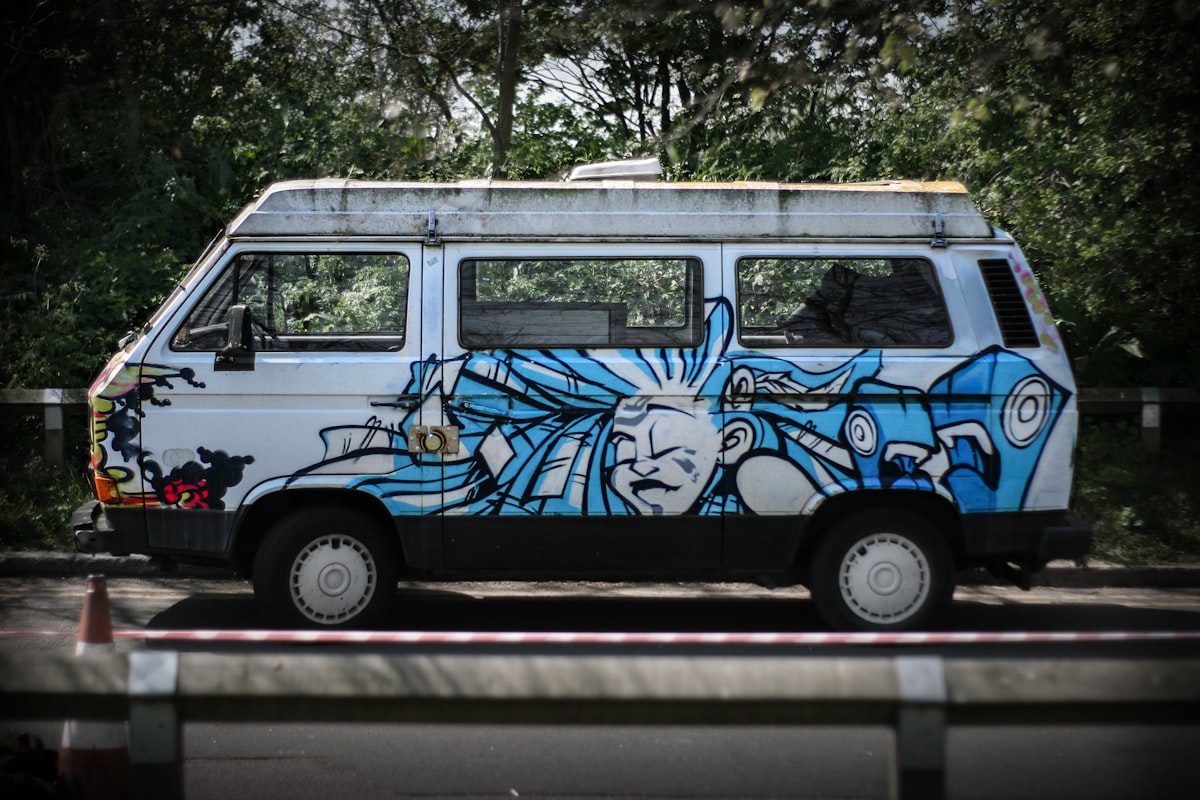 blue and white van on road during daytime related to Discover the Charm and Functionality of Art Van Bunk Beds