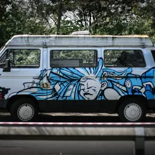 blue and white van on road during daytime related to Discover the Charm and Functionality of Art Van Bunk Beds