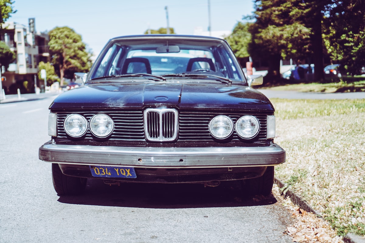 blue mercedes benz car on road during daytime related to BMW E30 Front Valance
