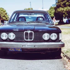 blue mercedes benz car on road during daytime related to BMW E30 Front Valance
