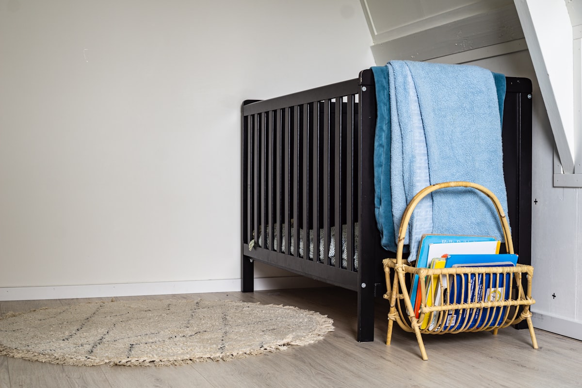 blue textile on brown wooden chair related to Attach the Bassinet to Bed: Essential Features and Benefits
