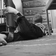 Boy playing in his room related to Under the Bed Safe: The Ultimate Solution for Hidden Security